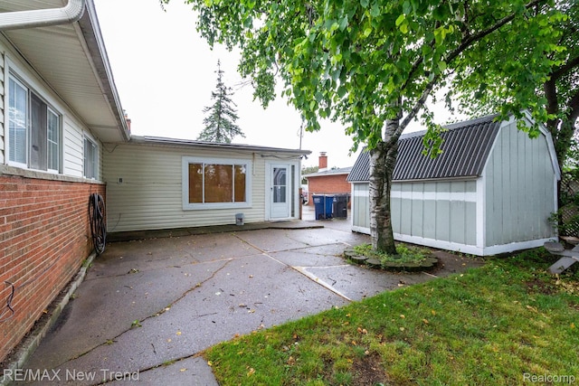 30604 Ann Arbor Trl, Westland, MI 48185 - back of property with a patio and a storage unit