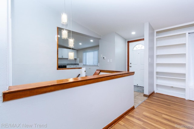30604 Ann Arbor Trl, Westland, MI 48185 - kitchen featuring light wood finished floors, lofted ceiling, pendant lighting, white cabinets, and recessed lighting