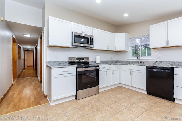 30604 Ann Arbor Trl, Westland, MI 48185 - kitchen featuring stainless steel appliances, white cabinetry, light stone counters, recessed lighting, and backsplash