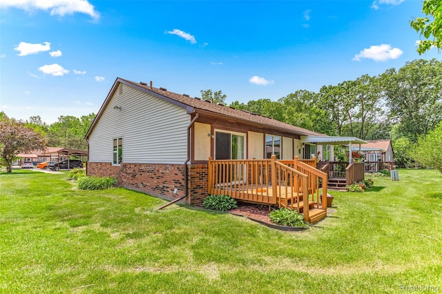 33050 Woodworth Ct, Westland, MI 48185 - back of house featuring a deck, brick siding, and a yard