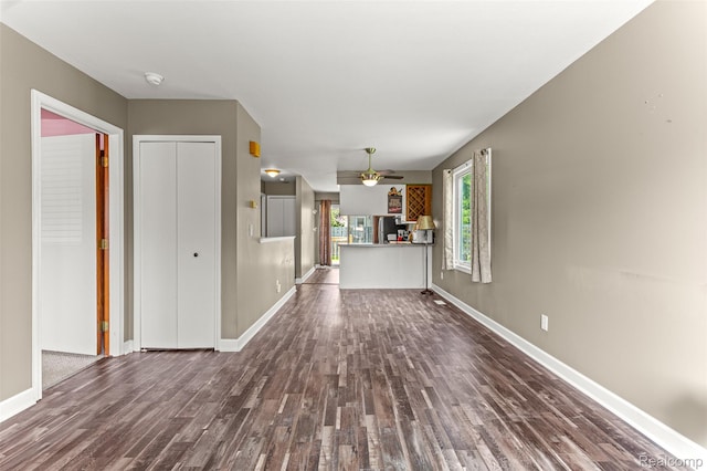33050 Woodworth Ct, Westland, MI 48185 - unfurnished living room with dark wood-style flooring and ceiling fan