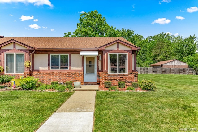 33050 Woodworth Ct, Westland, MI 48185 - view of front of property with brick siding, stucco siding, and a shingled roof