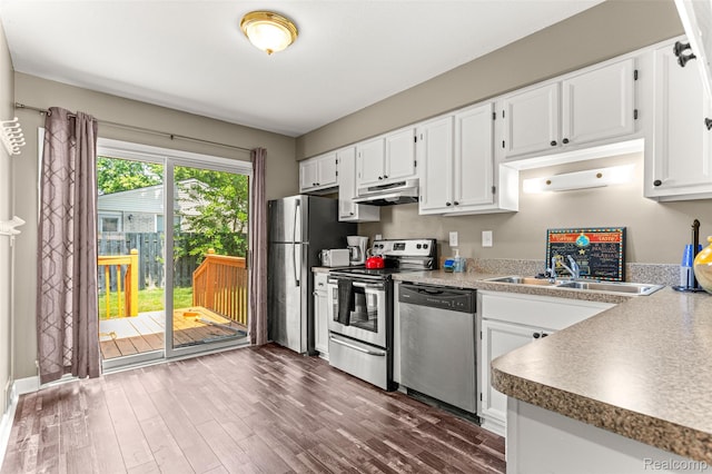 33050 Woodworth Ct, Westland, MI 48185 - kitchen featuring stainless steel appliances, range hood, white cabinets, and dark wood-style floors