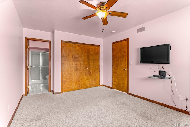 33050 Woodworth Ct, Westland, MI 48185 - unfurnished bedroom with carpet, a closet, ensuite bathroom, and a ceiling fan