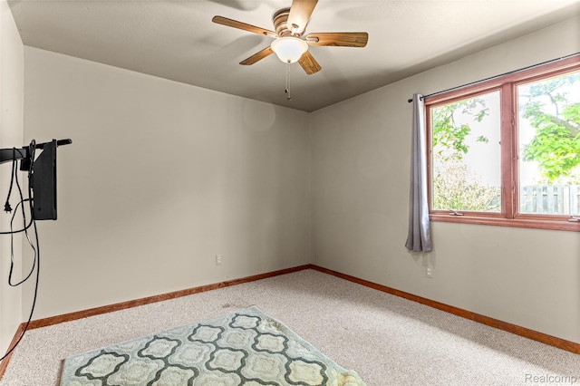 33050 Woodworth Ct, Westland, MI 48185 - carpeted spare room with baseboards and a ceiling fan