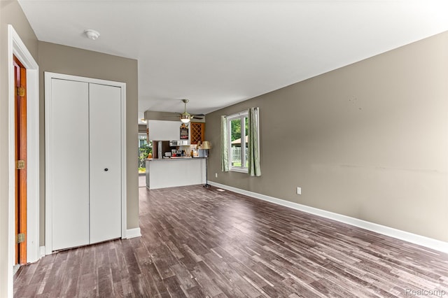 33050 Woodworth Ct, Westland, MI 48185 - unfurnished living room featuring dark wood finished floors and a ceiling fan