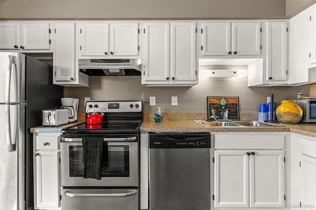 33050 Woodworth Ct, Westland, MI 48185 - kitchen with appliances with stainless steel finishes, range hood, white cabinets, and light countertops