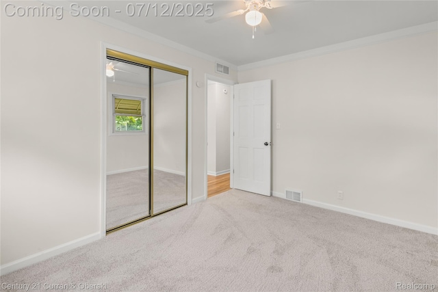 1681 Stieber St, Westland, MI 48186 - unfurnished bedroom featuring carpet flooring, crown molding, a closet, and a ceiling fan