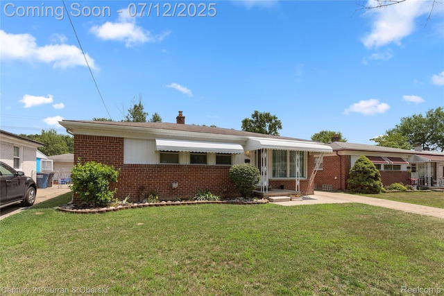 1681 Stieber St, Westland, MI 48186 - ranch-style home with brick siding, a front yard, and a chimney
