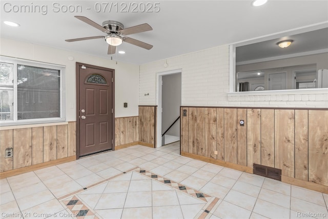 1681 Stieber St, Westland, MI 48186 - entrance foyer with wooden walls, ceiling fan, wainscoting, recessed lighting, and light tile patterned floors