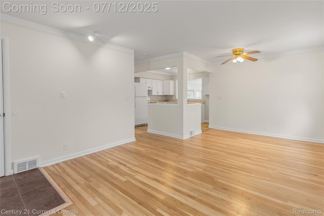 1681 Stieber St, Westland, MI 48186 - unfurnished living room with crown molding, light wood-style floors, and a ceiling fan
