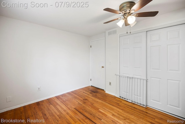 2900 Barton Dr, Sterling Heights, MI 48310 - unfurnished bedroom with light wood finished floors, a closet, and a ceiling fan