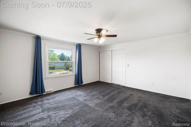 2900 Barton Dr, Sterling Heights, MI 48310 - unfurnished bedroom featuring ornamental molding, dark carpet, a closet, and ceiling fan