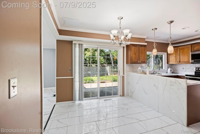2900 Barton Dr, Sterling Heights, MI 48310 - kitchen featuring ornamental molding, brown cabinetry, stainless steel microwave, light marble finish floors, and a chandelier