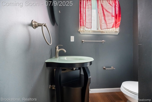 2900 Barton Dr, Sterling Heights, MI 48310 - bathroom with wood finished floors and toilet