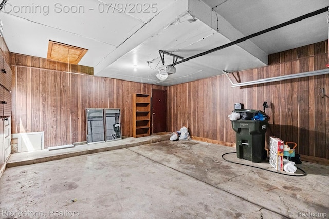 2900 Barton Dr, Sterling Heights, MI 48310 - garage with wooden walls and a garage door opener