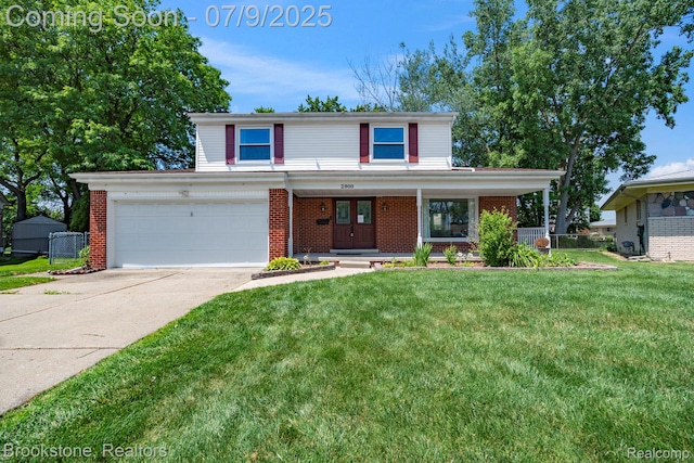 2900 Barton Dr, Sterling Heights, MI 48310 - traditional-style house with concrete driveway, covered porch, brick siding, and an attached garage