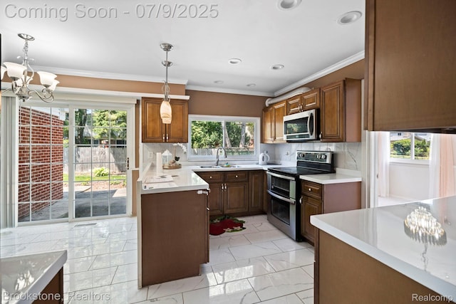 2900 Barton Dr, Sterling Heights, MI 48310 - kitchen featuring stainless steel appliances, a chandelier, light countertops, crown molding, and hanging light fixtures