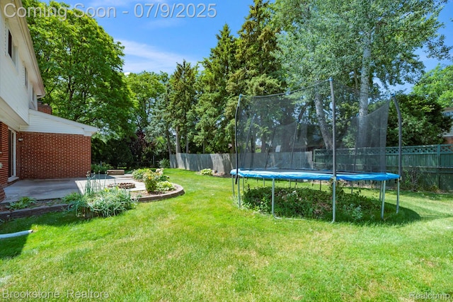 2900 Barton Dr, Sterling Heights, MI 48310 - fenced backyard featuring a trampoline and a patio