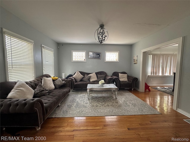 6815 Mettetal St, Detroit, MI 48228 - living area featuring plenty of natural light and wood finished floors