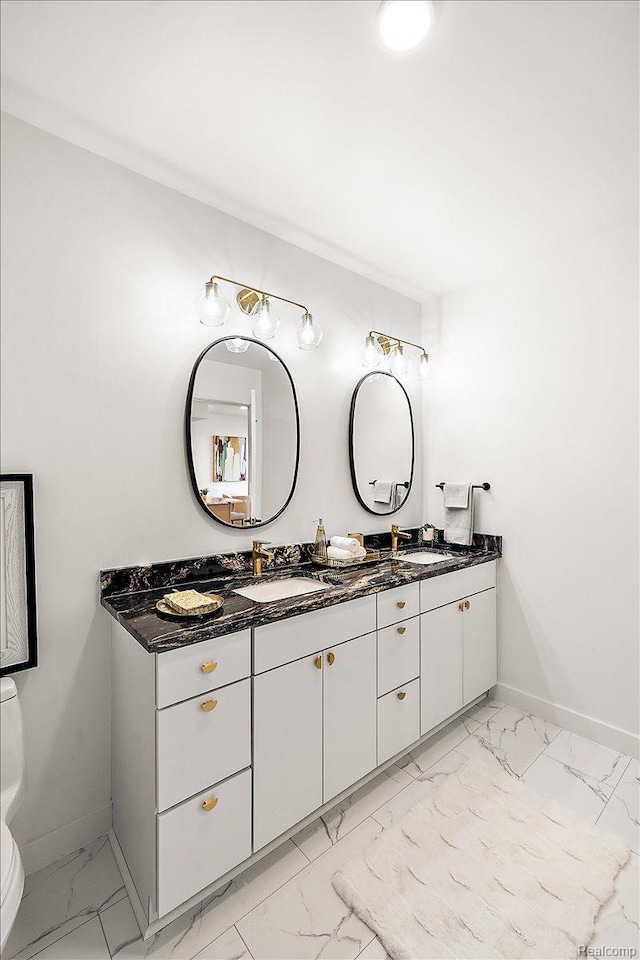 330 Gratiot Ave Unit 1504, Detroit, MI 48226 - bathroom featuring marble finish flooring and double vanity