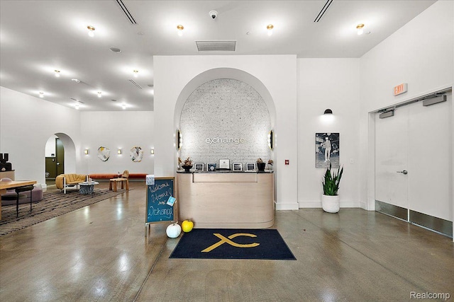 330 Gratiot Ave Unit 1504, Detroit, MI 48226 - reception with arched walkways and a security system