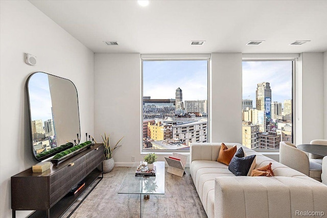 330 Gratiot Ave Unit 1504, Detroit, MI 48226 - living area with a view of skyline and healthy amount of natural light