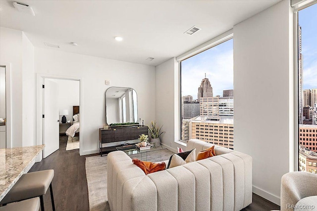 330 Gratiot Ave Unit 1504, Detroit, MI 48226 - living area featuring dark wood-style flooring, a city view, and recessed lighting