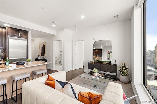 330 Gratiot Ave Unit 1504, Detroit, MI 48226 - living area featuring dark wood-style floors, recessed lighting, and arched walkways