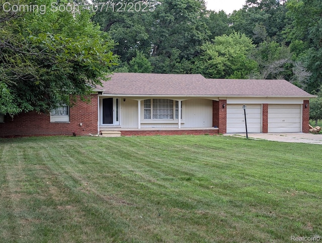 22048 Rougewood Dr, Southfield, MI 48033 - ranch-style house featuring brick siding, a garage, and a front yard