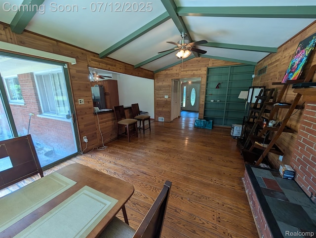 22048 Rougewood Dr, Southfield, MI 48033 - living area featuring wooden walls, wood finished floors, ceiling fan, and healthy amount of natural light