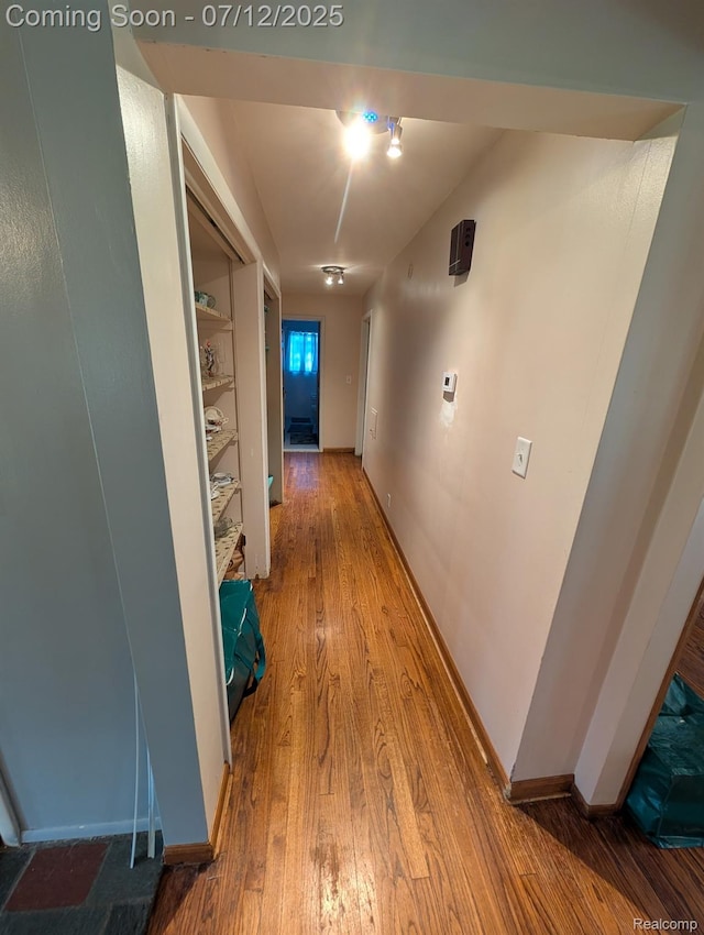22048 Rougewood Dr, Southfield, MI 48033 - hall with wood finished floors and baseboards