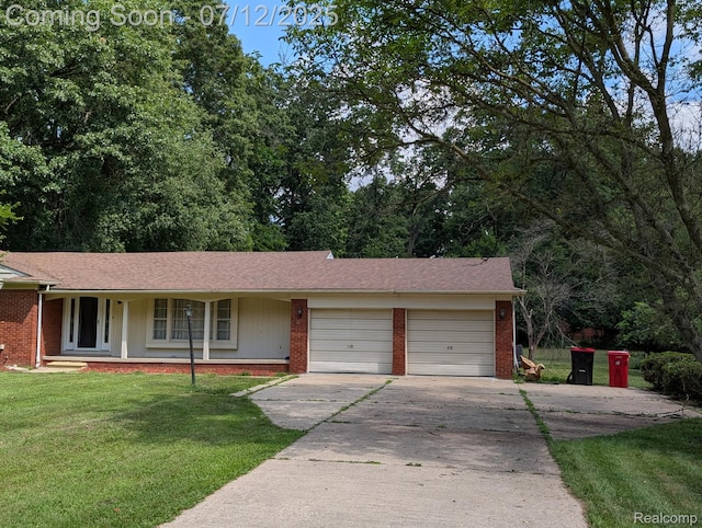 22048 Rougewood Dr, Southfield, MI 48033 - single story home with brick siding, driveway, an attached garage, and a front yard