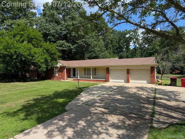 22048 Rougewood Dr, Southfield, MI 48033 - single story home with brick siding, driveway, an attached garage, and a front yard