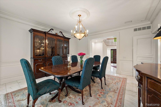 347 Pine Ridge Dr, Bloomfield Hills, MI 48304 - dining space featuring a chandelier, ornamental molding, and light marble finish flooring