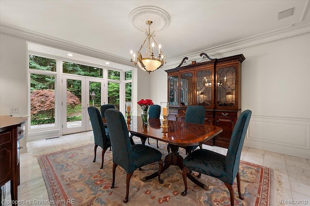 347 Pine Ridge Dr, Bloomfield Hills, MI 48304 - dining room with french doors, crown molding, and a chandelier
