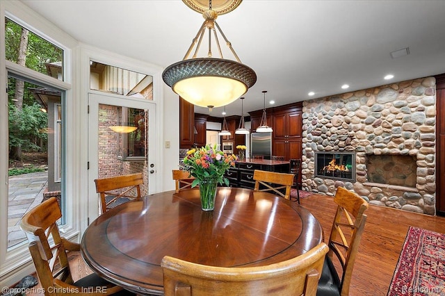 347 Pine Ridge Dr, Bloomfield Hills, MI 48304 - dining room with wood finished floors, recessed lighting, and a fireplace