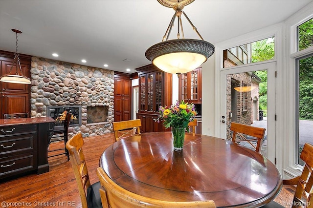 347 Pine Ridge Dr, Bloomfield Hills, MI 48304 - dining room with wood finished floors, recessed lighting, and a stone fireplace