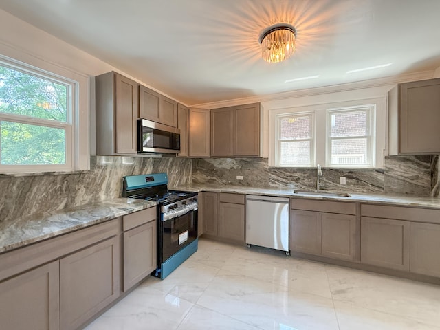 15786 Rutherford St, Detroit, MI 48227 - kitchen featuring appliances with stainless steel finishes, light marble finish floors, decorative backsplash, and light stone countertops
