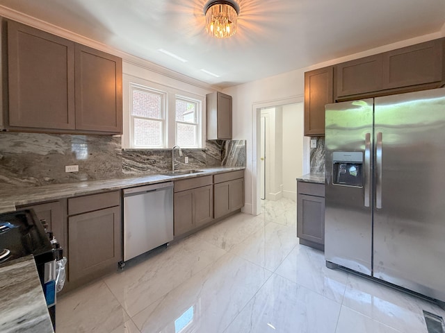 15786 Rutherford St, Detroit, MI 48227 - kitchen featuring stainless steel appliances, tasteful backsplash, light marble finish flooring, and light stone counters