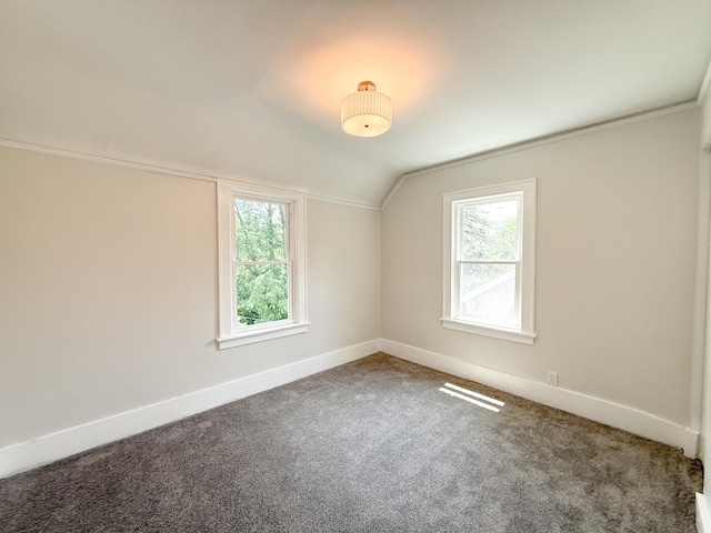 15786 Rutherford St, Detroit, MI 48227 - carpeted empty room featuring vaulted ceiling and baseboards