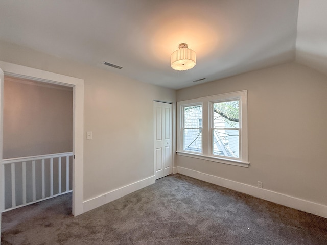 15786 Rutherford St, Detroit, MI 48227 - unfurnished bedroom featuring carpet flooring, a closet, and vaulted ceiling