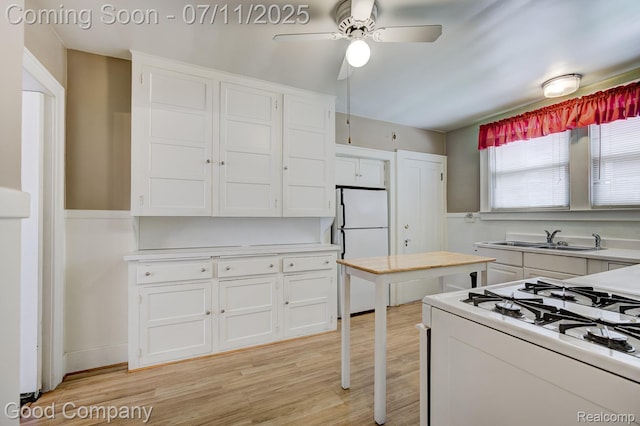 515 W Golden Gate, Detroit, MI 48203 - kitchen with white appliances, white cabinetry, and light countertops