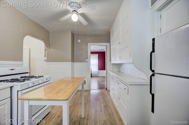 515 W Golden Gate, Detroit, MI 48203 - kitchen featuring white appliances, ceiling fan, light wood-style flooring, white cabinets, and light countertops