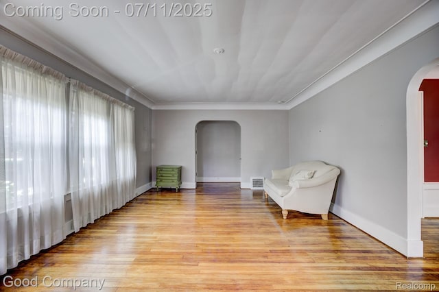 515 W Golden Gate, Detroit, MI 48203 - living area with arched walkways, light wood-type flooring, and ornamental molding