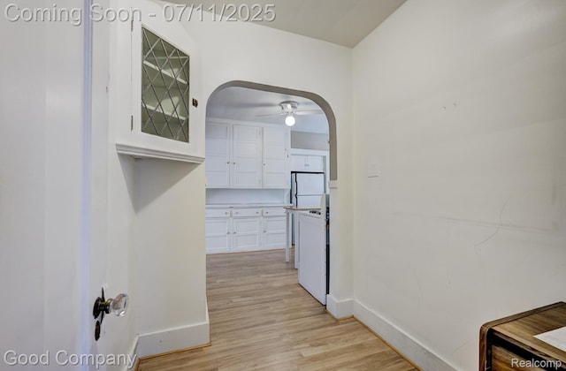 515 W Golden Gate, Detroit, MI 48203 - hallway with arched walkways and light wood-style floors