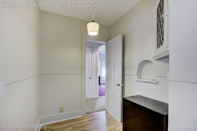 515 W Golden Gate, Detroit, MI 48203 - hallway with arched walkways and light wood-type flooring