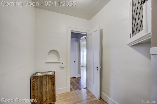 515 W Golden Gate, Detroit, MI 48203 - hallway featuring wood finished floors and arched walkways