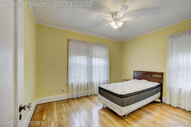 515 W Golden Gate, Detroit, MI 48203 - bedroom featuring multiple windows, crown molding, hardwood / wood-style floors, and a ceiling fan