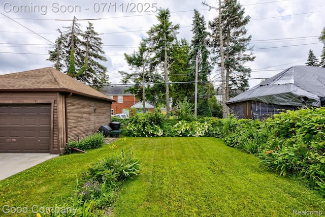 515 W Golden Gate, Detroit, MI 48203 - view of green lawn with an outdoor structure and a garage